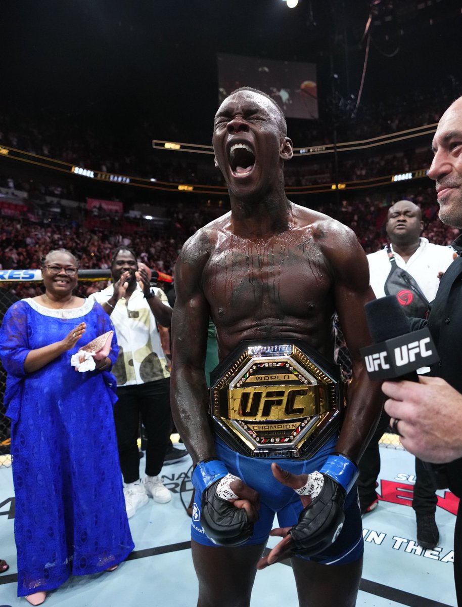MMAHistoryToday's tweet photo. Jon Jones and Israel Adesanya are both thriving as UFC Champions. 

The two biggest stars in the sport today. https://t.co/ThBzl1gUzi