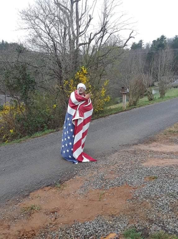 PyrettaJ's tweet photo. @LoisQuiver @EdwardPeterBla1 Oh and this is what Eddie really thinks about  our service men and women. Here he has taken the flag that draped the coffin of a Vietnam vet and has wrapped himself in it dragging it thru the dirt and mud to take vanity pics! The arrogance and callous disregard is appalling https://t.co/LGAYrK5uHb
