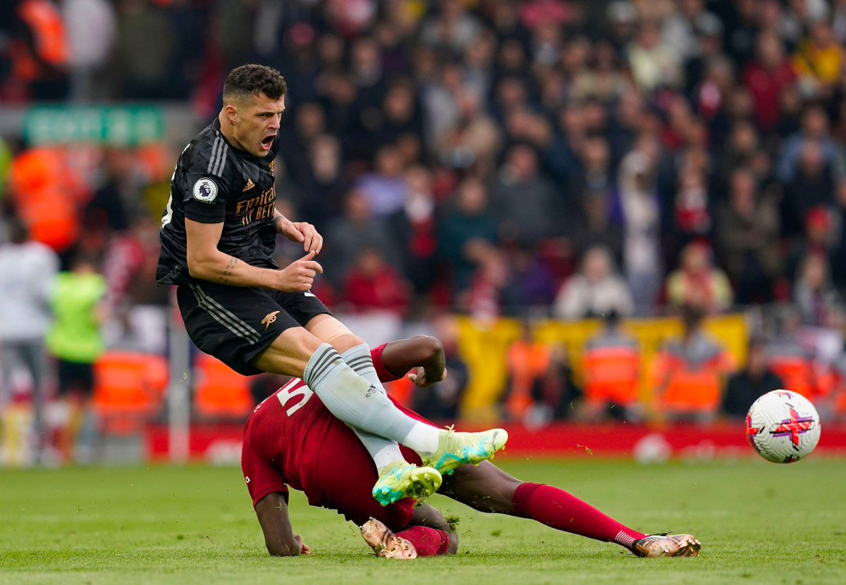 Footballtweet's tweet photo. Konate sent Xhaka flying. ✂️🔴 https://t.co/lOQ6qbV4S6