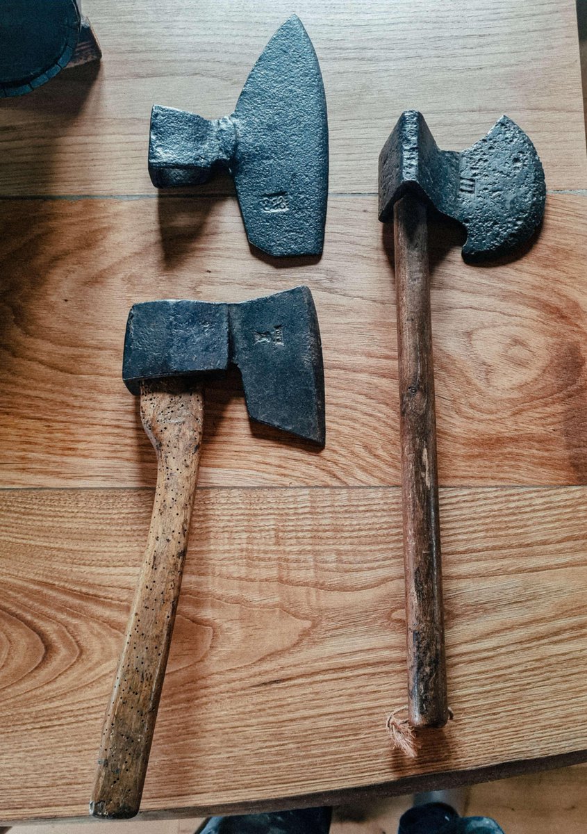 a neighbour was nice enough to bring me 3 new axes to add to the collection, the two on the left are barrel maker's doloires, i think the one on the right might be a clog maker's doloire but i'm not 100% sure