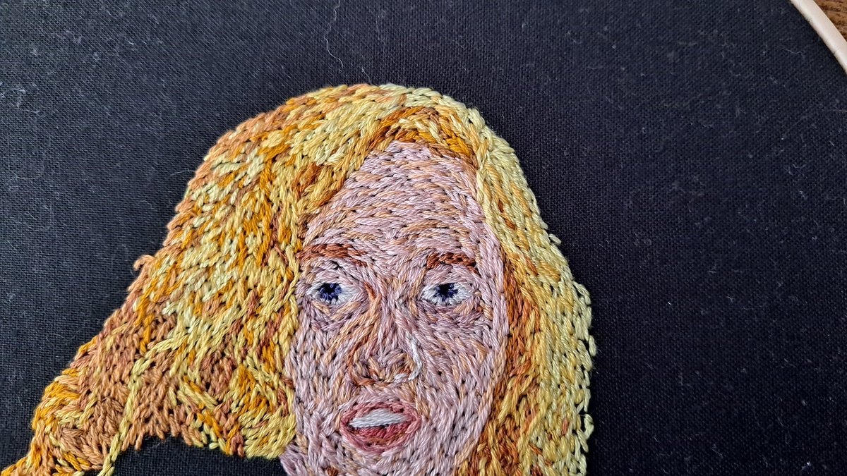 HandmadeHeartz's tweet photo. BEHOLD!
My first attempt at an embroidered portrait!

This was done in shades of coral for this #AutismAcceptanceMonth's #AutisticCreativeFestival's #InfiniTints by @tismoonie.
The prompt was "Calm Coral: What brings you peace?" The model is my partner, @ablondpanda.  💝 https://t.co/sl6tsyTIVx