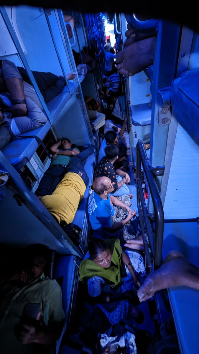 iamsrf8's tweet photo. On top of it there are people sleeping on the floor making it difficult for the travellers with reservation making the journey cumbersome https://t.co/zSFOdwLOiH