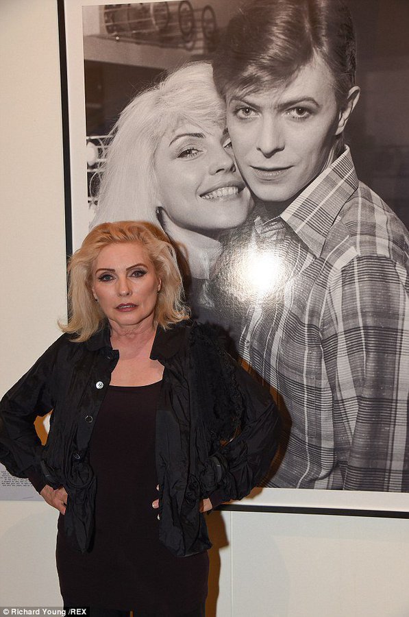 crockpics's tweet photo. Debbie Harry in front of a picture of her and David Bowie from the 70s https://t.co/bSRS4xqhUN