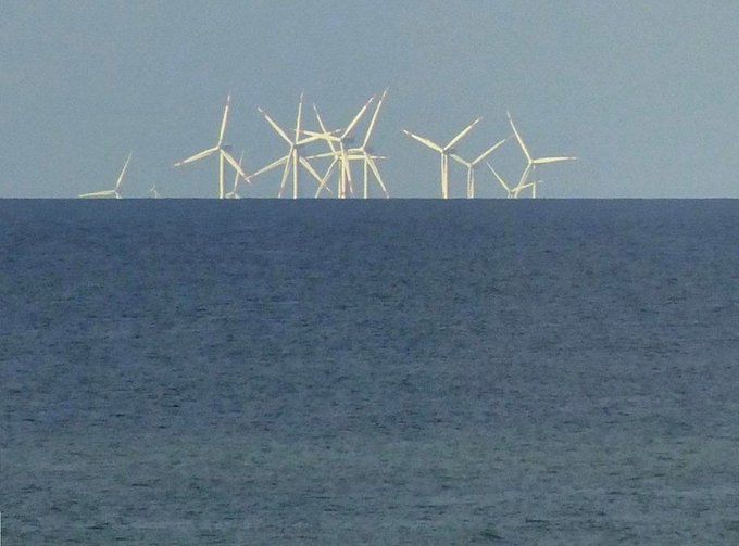 Rainmaker1973's tweet photo. This picture of the Thorntonbank offshore windpark in front of the Belgian coast perfectly shows the earth curvature 

[source, read more: https://t.co/mtb7vcw765] https://t.co/vD6CstB9kt
