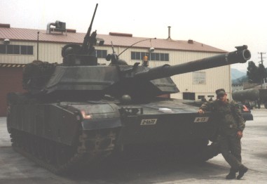Korean_DMZ_Vets's tweet photo. Tank Tuesday Eve - M1IP Abrams along with my old friend Jong Huh in 1st Tank's (1/72nd AR) Motor Pool at Camp Casey, Korea in the fall of 1990! #tanks #armor #m1ip #2id #abrams #tanktuesday #ilovetanks #tanklover #m1abrams #1stTank https://t.co/eIjNAaErhs