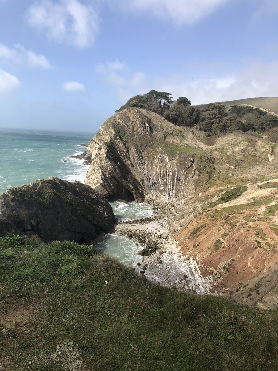LouisKinnear's tweet photo. Swapped Cyprus this year for the (arguably superior) Jurassic coast. Complete with friendly mocking for my over-enthusiasm #geology #fossils #lulworthcrumple https://t.co/cbmwnz7hkL