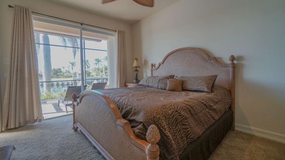 King size bedroom overlooking the water with it's own bathroom. #Vacation #RentalByOwner #MarcoIsland #Florida #Home #LuxuryHome #PrivatePool #Property