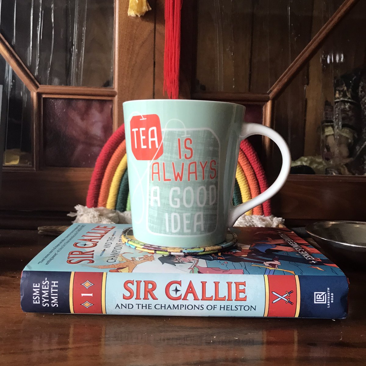 GoodKnightJosie's tweet photo. What better way to spend a lazy bank holiday than with a book and a mug of tea?

Absolutely adored @EsmeSymesSmith’s Sir Callie and the Champions of Helston. It was fun, beautiful and moving - I can’t wait to get my hands on the next one!

#readingcommunity #sircallie #lovebooks https://t.co/jPFsDJiHcc
