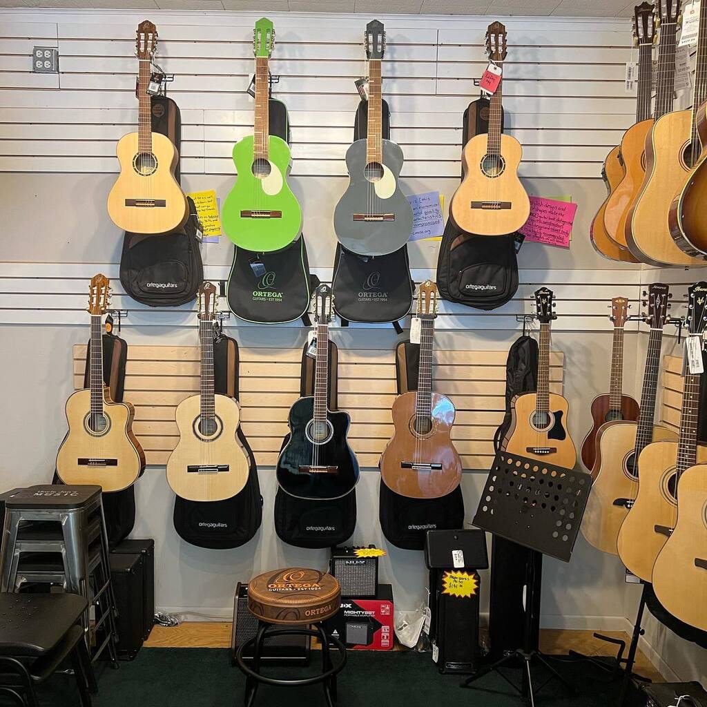 Ortega wall!  Stop by for some fine classical guitars!  <a href="/ortegaguitars/">Ortega Guitars</a> #guitars #shoplocal instagr.am/p/Cq3g4bYOY94/