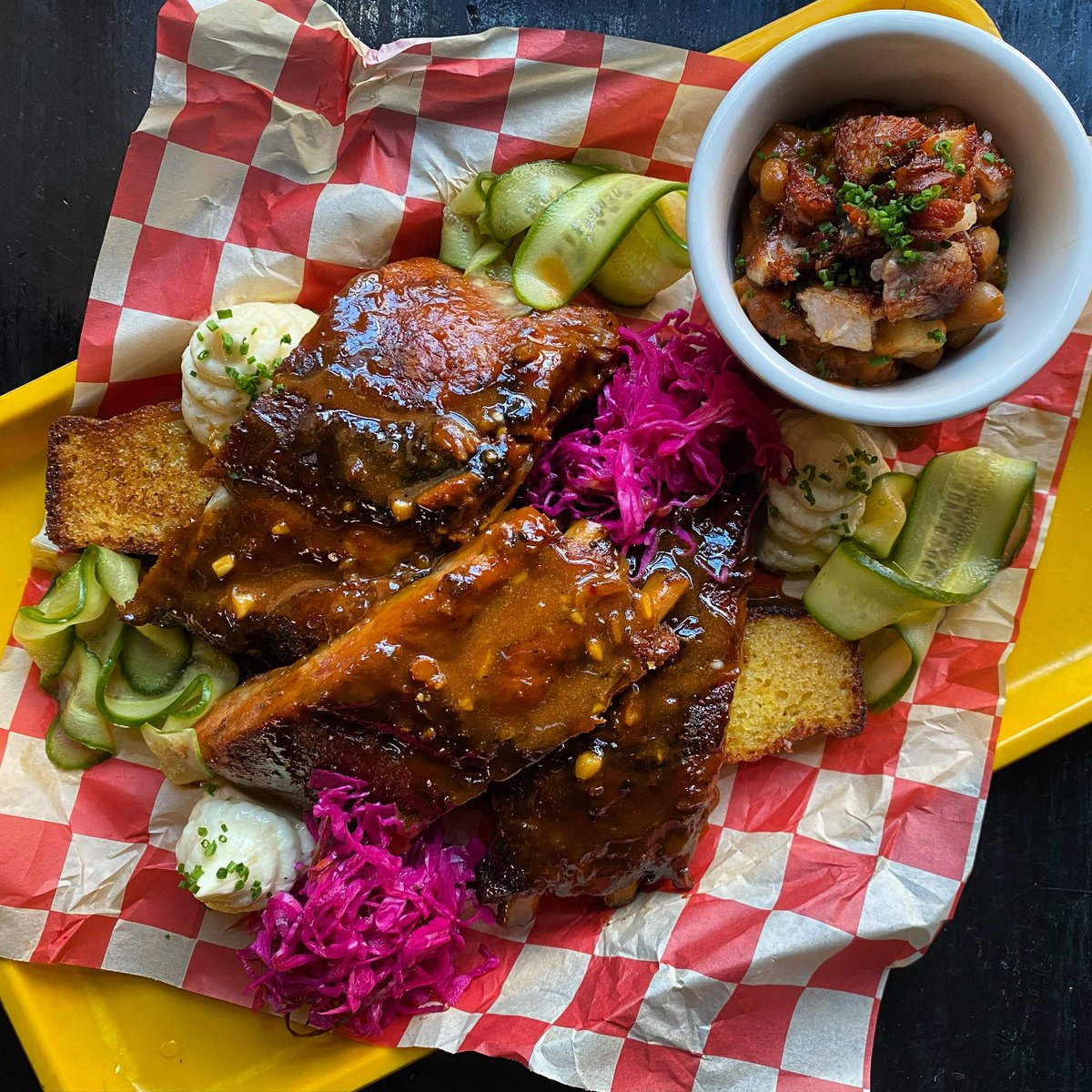 Special tonight (4/10): Slow Roasted Baby Back Ribs with a mustard-miso glaze, smoked cheddar &amp; jalapeño corn bread, bacon fat butter, pork belly baked beans, pickled cabbage and ginger Persian cucumber 🤤