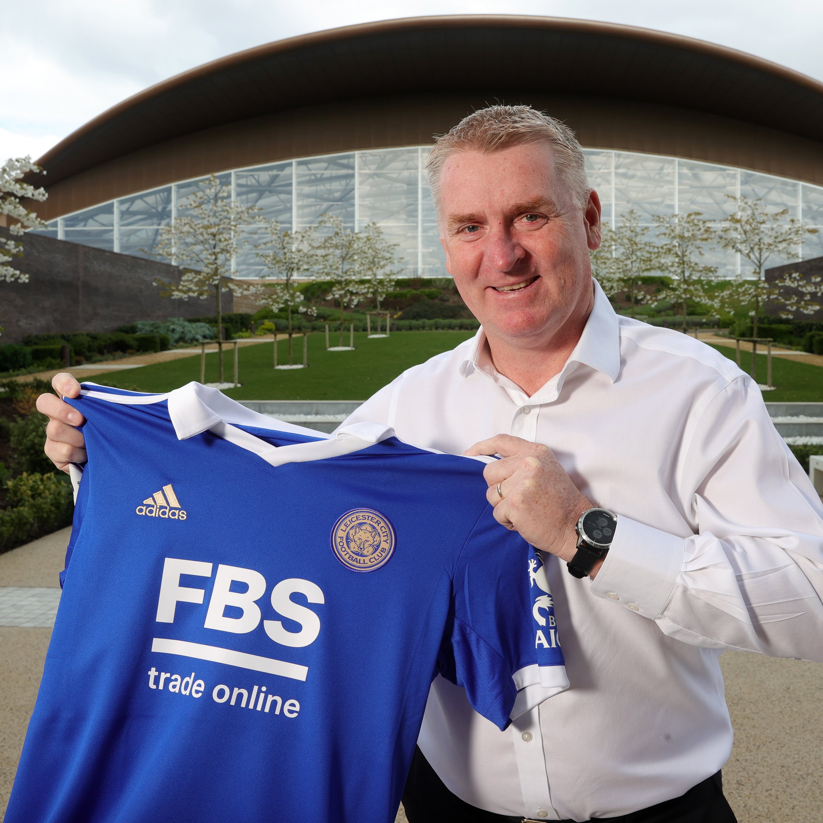 Dean Smith holds the Club's home shirt in Seagrave.