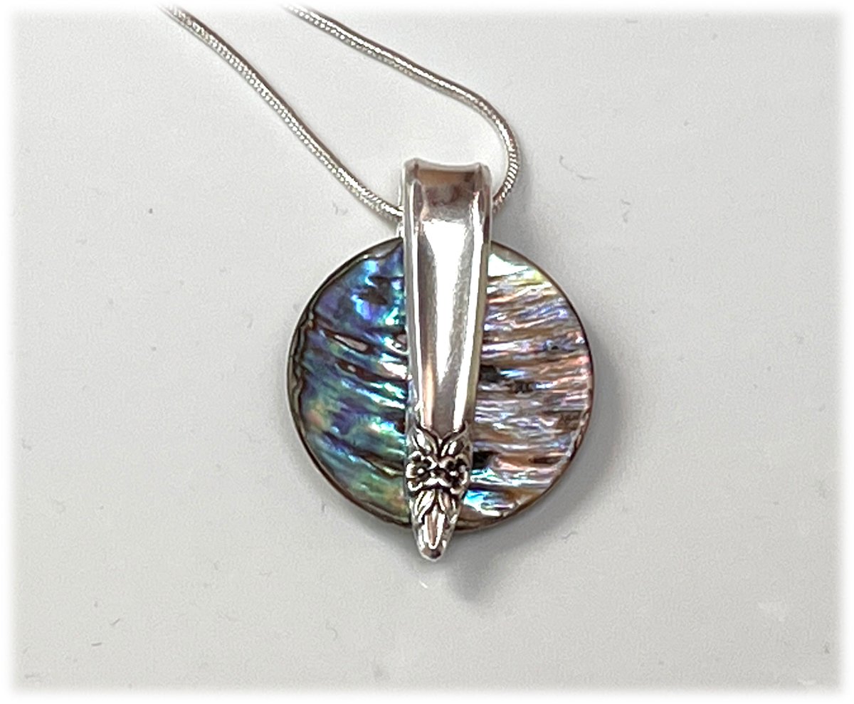 jradca's tweet photo. Like a Monet painting in a shell! Abalone Garland Demitasse Pendant, Mid Century 1965 Silverplate, Rainbow Color Shell, Colorful Necklace https://t.co/C1coPZgIcc #silver #circle #rainbow #yes #women #upcycled #silverplateflatware #upcycledflatware #abaloneandsilver https://t.co/CtuBlBKdfc