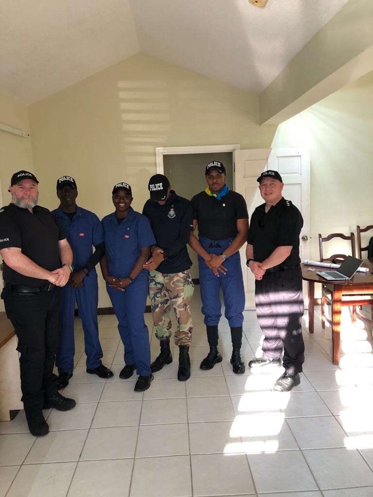 collegepnsc's tweet photo. Whilst some of us were having R&R over Easter, our Learning Standards Manager C/Insp Mark Sweeney @Sweens9904 and Sgt Mike Spencer were in @UKinMontserrat helping with a #missingpersonenquiry #harshconditions #hot #hardwork #greatwork #partnershipworking https://t.co/0DjeKZJT5k