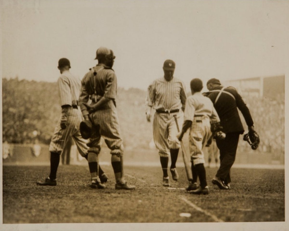 100YearsAgoNews's tweet image. April 18, 1923: The first game is played at Yankee Stadium. A crowd of 74,217 flocks to the Bronx to see the home team win, 4-1. Babe Ruth hits the first home run there, helping beat his old team, the Boston Red Sox. He’s seen touching home and with bat boy Ray Kelly. 1/5