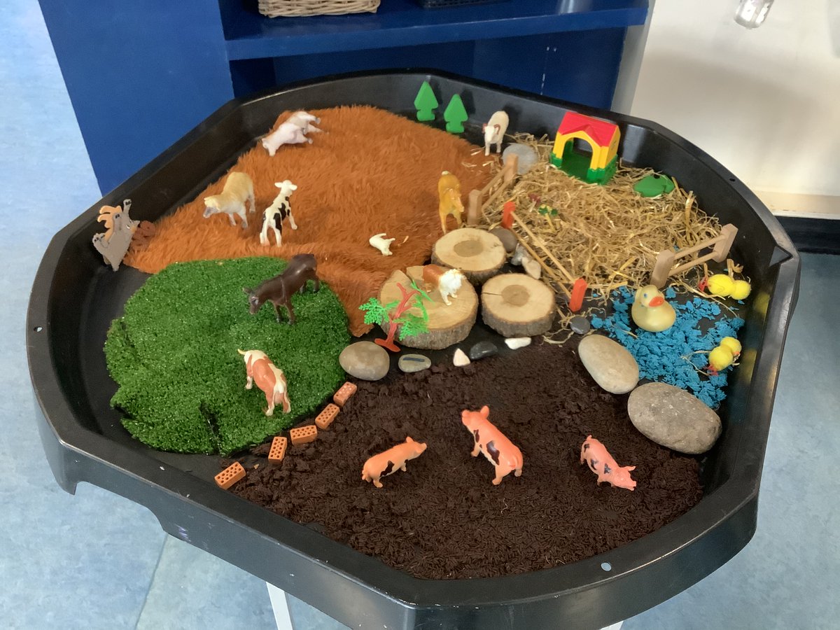 Look at the beautiful farm small world activities set up for the children.