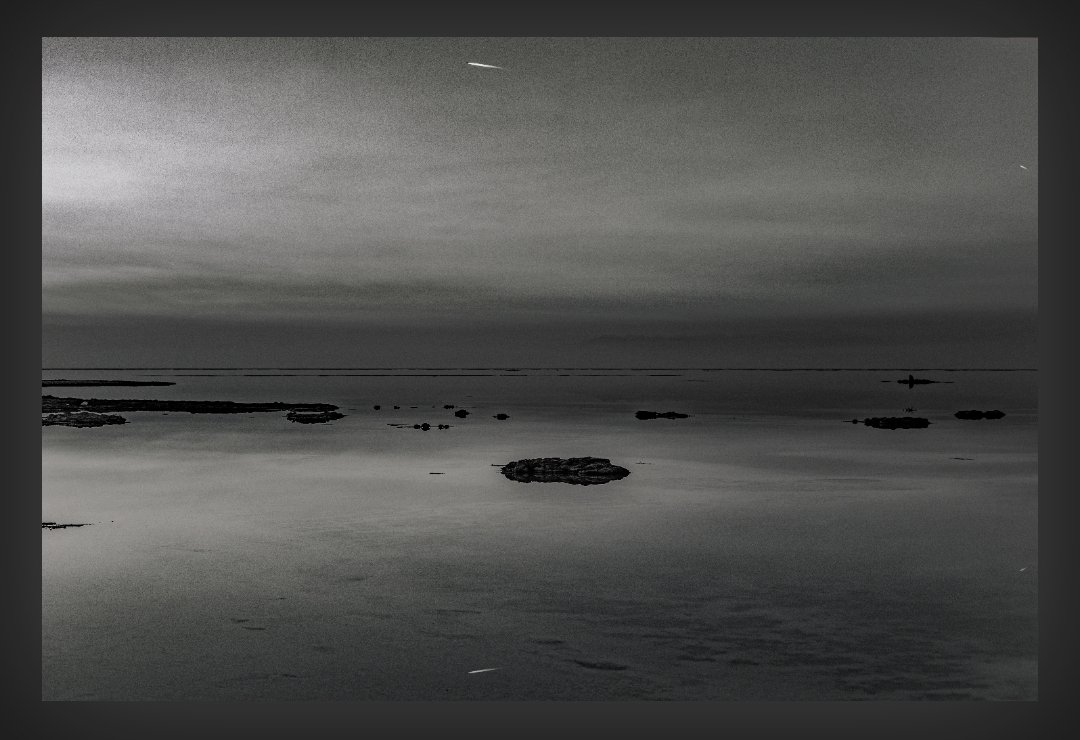 "Desolate Mirage"
This black and white photograph captures the surreal and desolate beauty of a drying salt lake. Shallow water reflects the...

Now available on <a href="/objktcom/">objkt</a>
Price is just: 3 xtz
It is one of my favorites🔥
🔗👉objkt.com/asset/KT1SocgH…
#NFT
#NFTartwork 
#NFTdrops