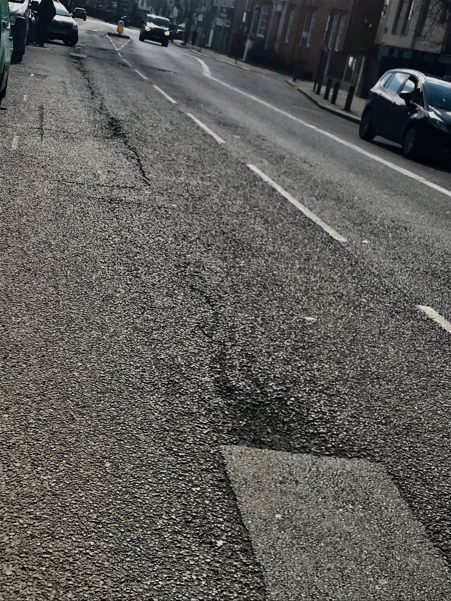artglyn's tweet photo. The State of #GarrattLane, between #Quinton St and #Summerstown
#Cyclists beware! Avoiding potholes, random rubble and traffic is no mean feat here. 
When is this likely to be done? Can we please have sustainable drainage? https://t.co/Ngyrj7qBgp