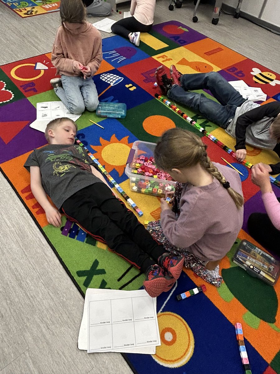 To wrap up our measurement unit, 1st graders measured how many cubes tall their partner is. #theMESway