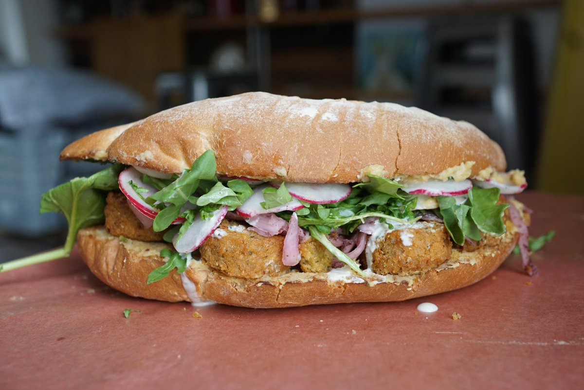 WE DID A COLLAB WITH A DOG. ISNT THAT CRAZY!? IT BARKED INTO GOOGLE TRANSLATE AND OUT CAME THIS SANDWICH. 

falafel/hummus/radish/mint tahini drizz/sumac onions/arugula 

Portion of sales will go towards @scars_care for those fur babies in need.