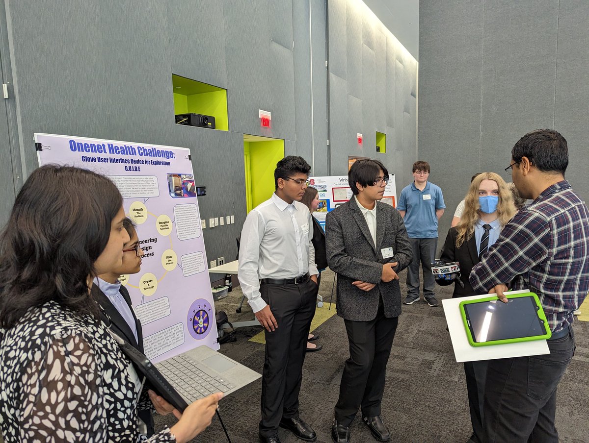 Judging has BEGUN in our 2023 Wearable Devices Challenge! The team from <a href="/EnloeMagnetHS/">Enloe High School</a> are chatting with a judge about their GUIDE device. @STEM_WCPSS <a href="/WCPSS/">Wake County Public School System</a> <a href="/wcpssmagnets/">WCPSS Office of Magnet Schools (Choice Schools)</a> #STEMeducation