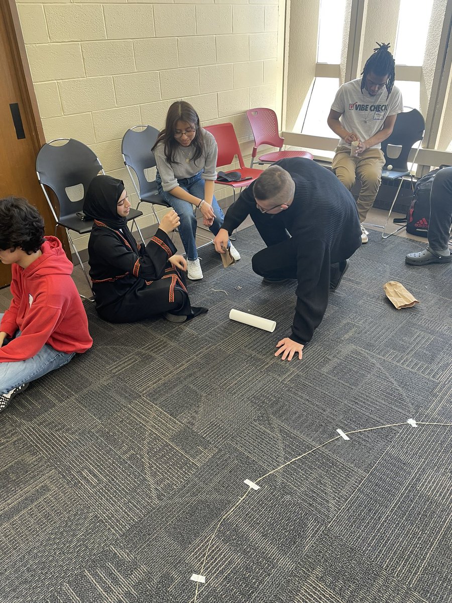 CoachSchutz's tweet photo. The “engineers” have to get the ping pong ball into the cup using only the materials provided. @argohs217 @ArgoGuidance @thisisUIC https://t.co/OGubdJRVKI