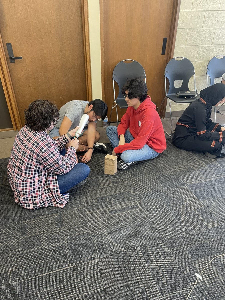 CoachSchutz's tweet photo. The “engineers” have to get the ping pong ball into the cup using only the materials provided. @argohs217 @ArgoGuidance @thisisUIC https://t.co/OGubdJRVKI