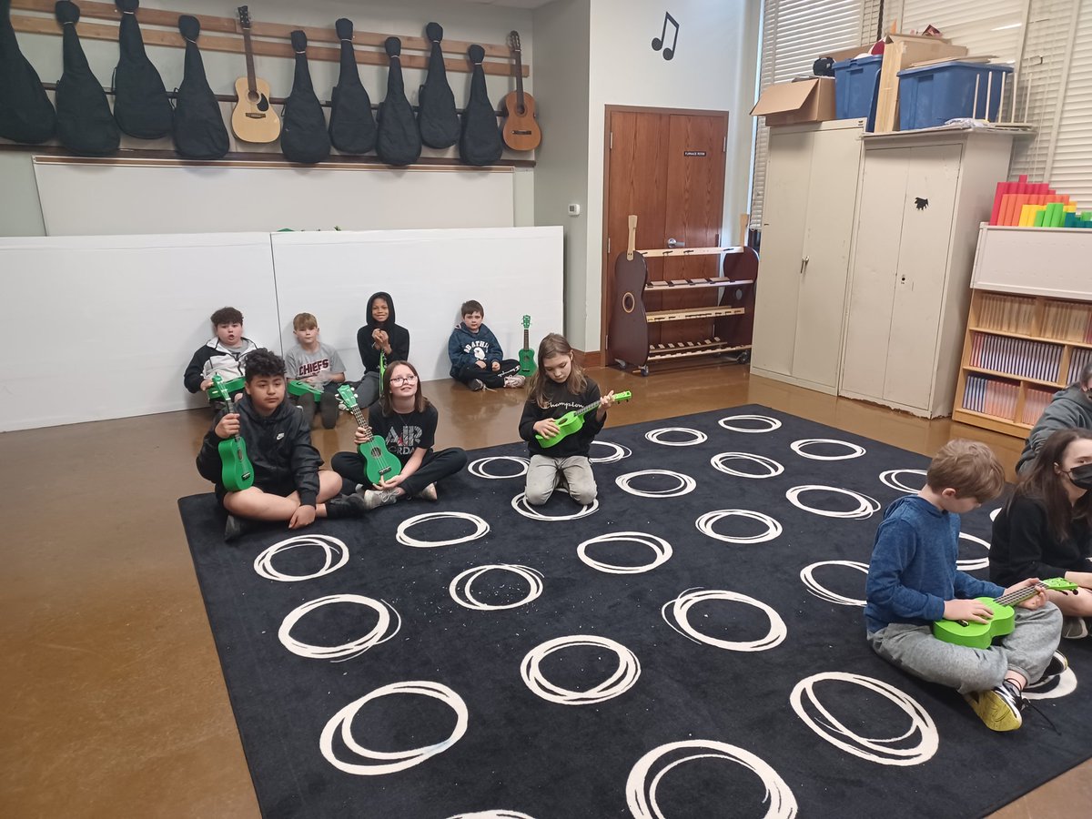 Mrs. Turner is plucking the ukulele strings with 5th grade! Who else loves that sound!?