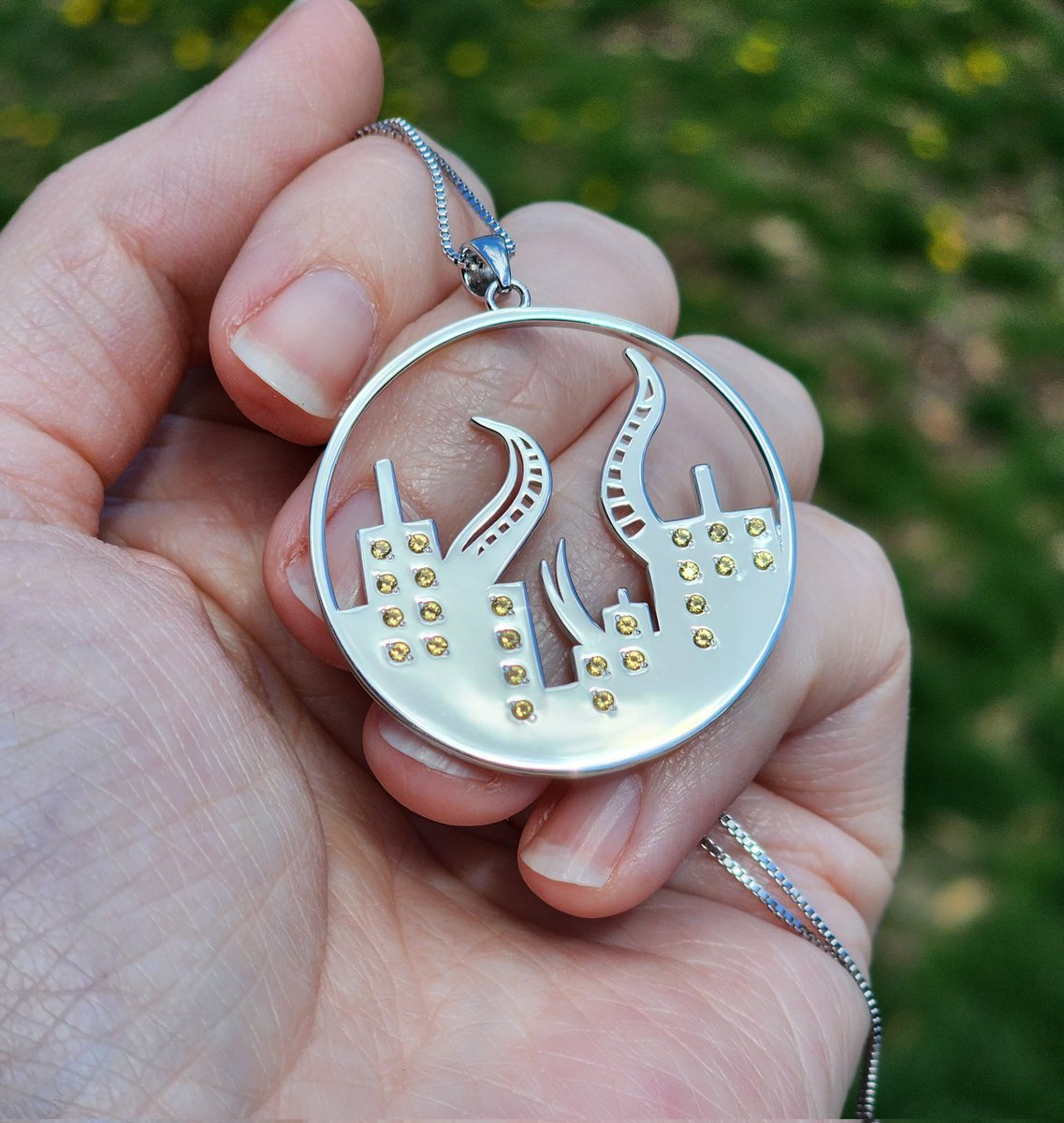 casting_adlo's tweet photo. and the city lights shone through the night, welcoming the Traveler home.

✨ Sterling silver Amaurot pendant, hand set with sparkling CZ
✨ Fully customizable - silver (pictured), gold, rose gold, or gunmetal and your choice of stone color(s) https://t.co/rMgGXZot80