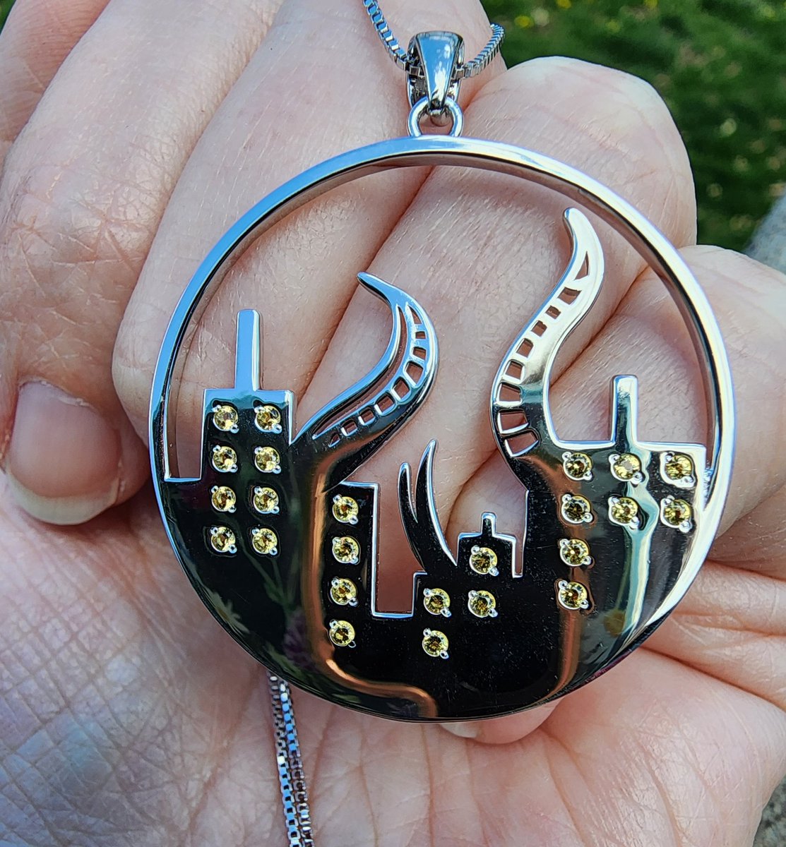 casting_adlo's tweet photo. and the city lights shone through the night, welcoming the Traveler home.

✨ Sterling silver Amaurot pendant, hand set with sparkling CZ
✨ Fully customizable - silver (pictured), gold, rose gold, or gunmetal and your choice of stone color(s) https://t.co/rMgGXZot80