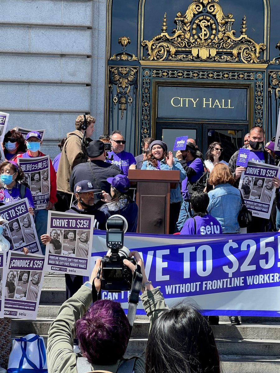 SEIU2015's tweet photo. 💥 HAPPENING NOW! 💥 EVP @KimEvonSEIU2015 and member leader Delmy Campos rally members along with our sister union @SEIU1021 in front of San Francisco City Hall! Workers providing essential human services demand $25/hour for ALL healthcare workers in SF! #PutCareFirst #DriveTo25 https://t.co/wFqSC41E1r
