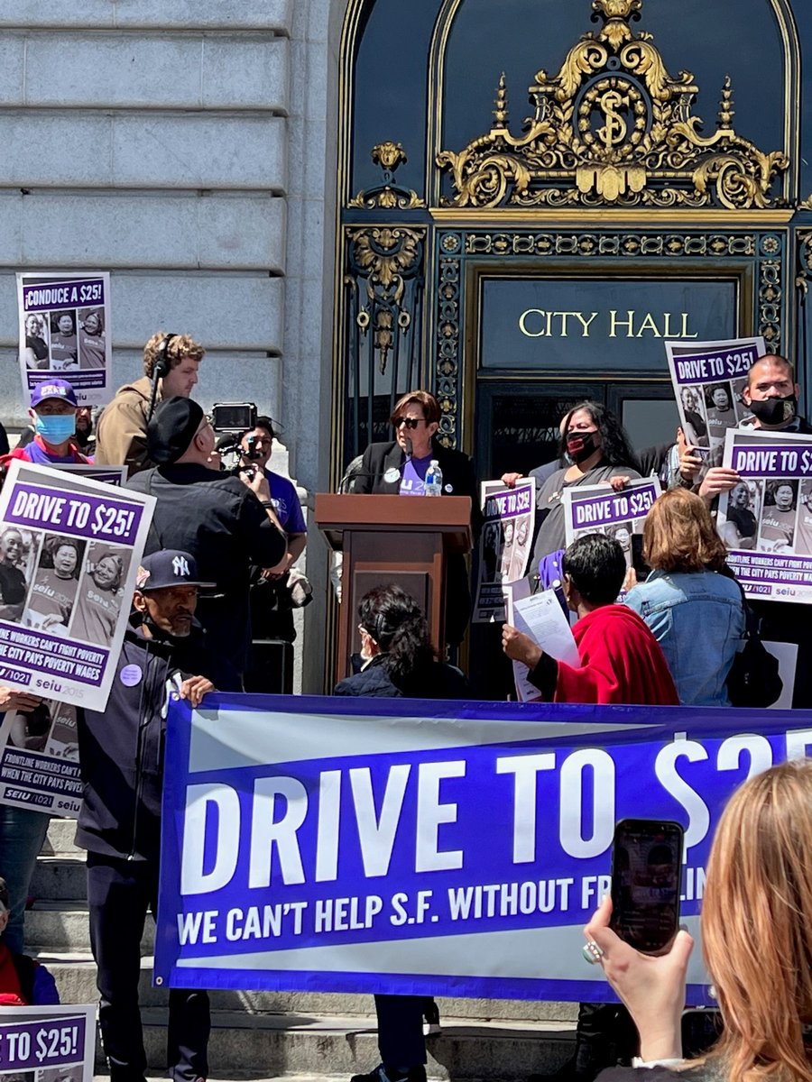 SEIU2015's tweet photo. 💥 HAPPENING NOW! 💥 EVP @KimEvonSEIU2015 and member leader Delmy Campos rally members along with our sister union @SEIU1021 in front of San Francisco City Hall! Workers providing essential human services demand $25/hour for ALL healthcare workers in SF! #PutCareFirst #DriveTo25 https://t.co/wFqSC41E1r
