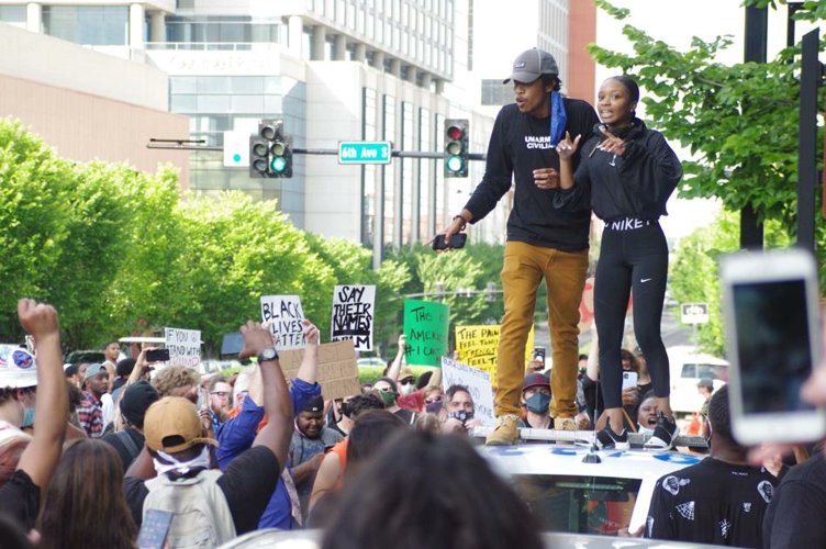 EndWokeness's tweet photo. TN Rep. Justin Jones standing on top of a police car during a BLM riot in June 2020: https://t.co/jexFQD7uvc