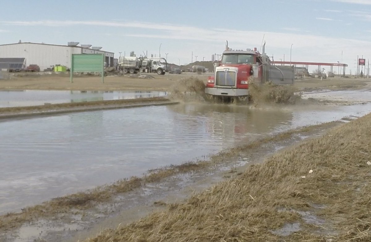 CTVGareth's tweet photo. Playing in Puddles….. that’s my job today.  Huge puddle on Fleet Street North had some drivers turning around…… but certainly not all. #yqrtraffic #yqr #spring #puddles #springpuddles https://t.co/6KAqs0mow7