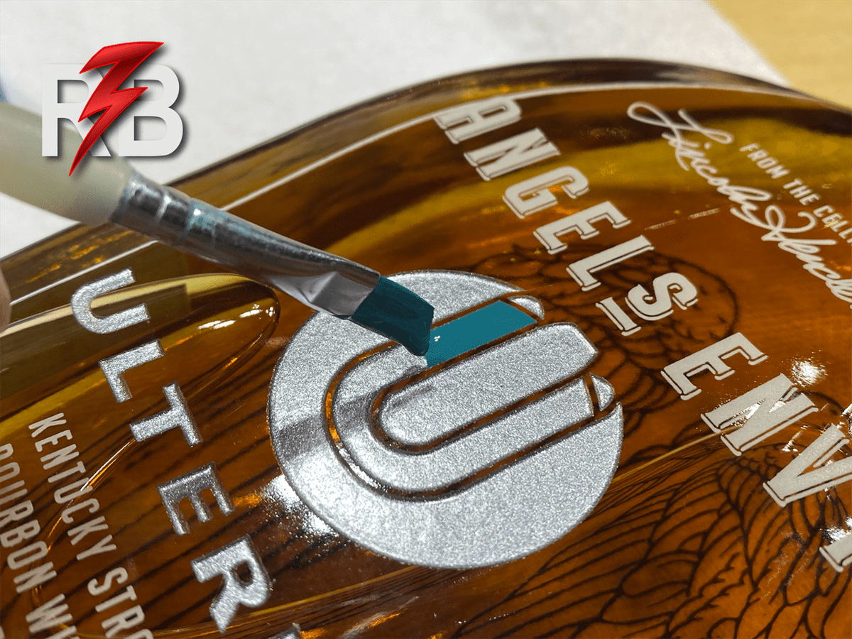 If you're looking for a unique and personalized gift for your customers, consider glass carvings or etched and paint-filled whiskey bottles with your company or event logo. redboltlaser.com