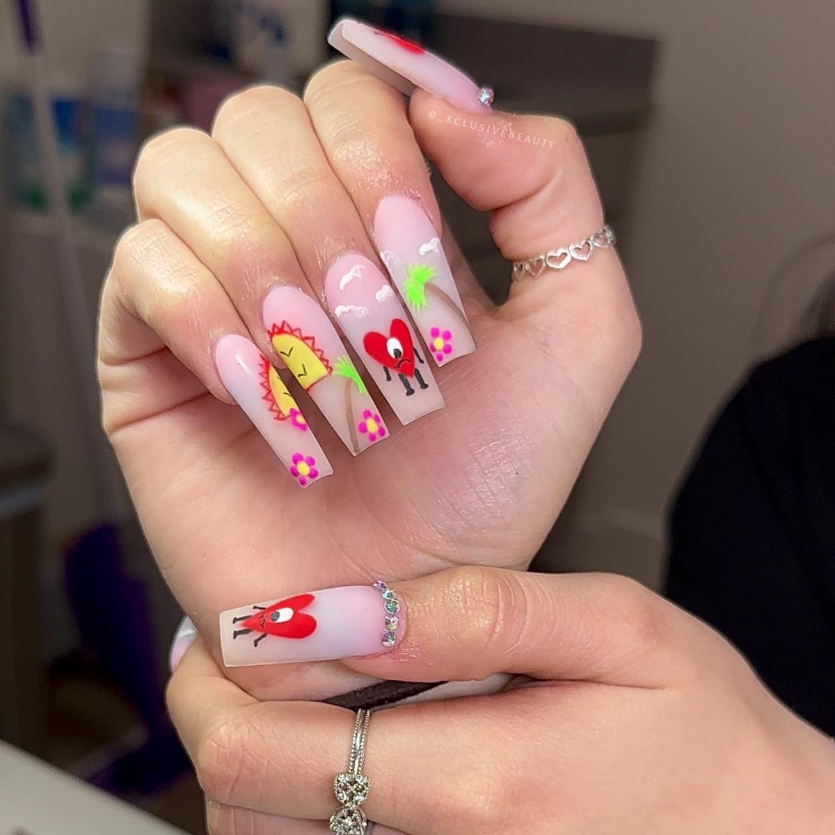 Jereenaa's tweet photo. Just did these bad bunny nails on a family member who brought me inspo on Pinterest &amp; I have NO IDEA what to price these 😭 fellow nail techs help me out pls #nailtech #nails https://t.co/SbR385NeDn