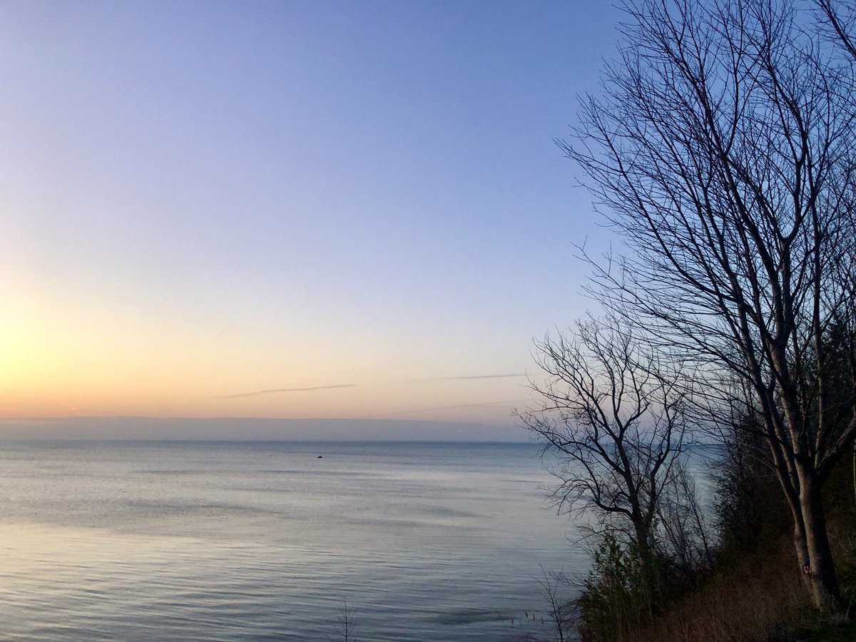 It’s 58 degrees just before sunrise. Looking SE across #LakeHuron, the sky above is clear. Seagulls call. #michiganspring #huroncounty #GreatLakes