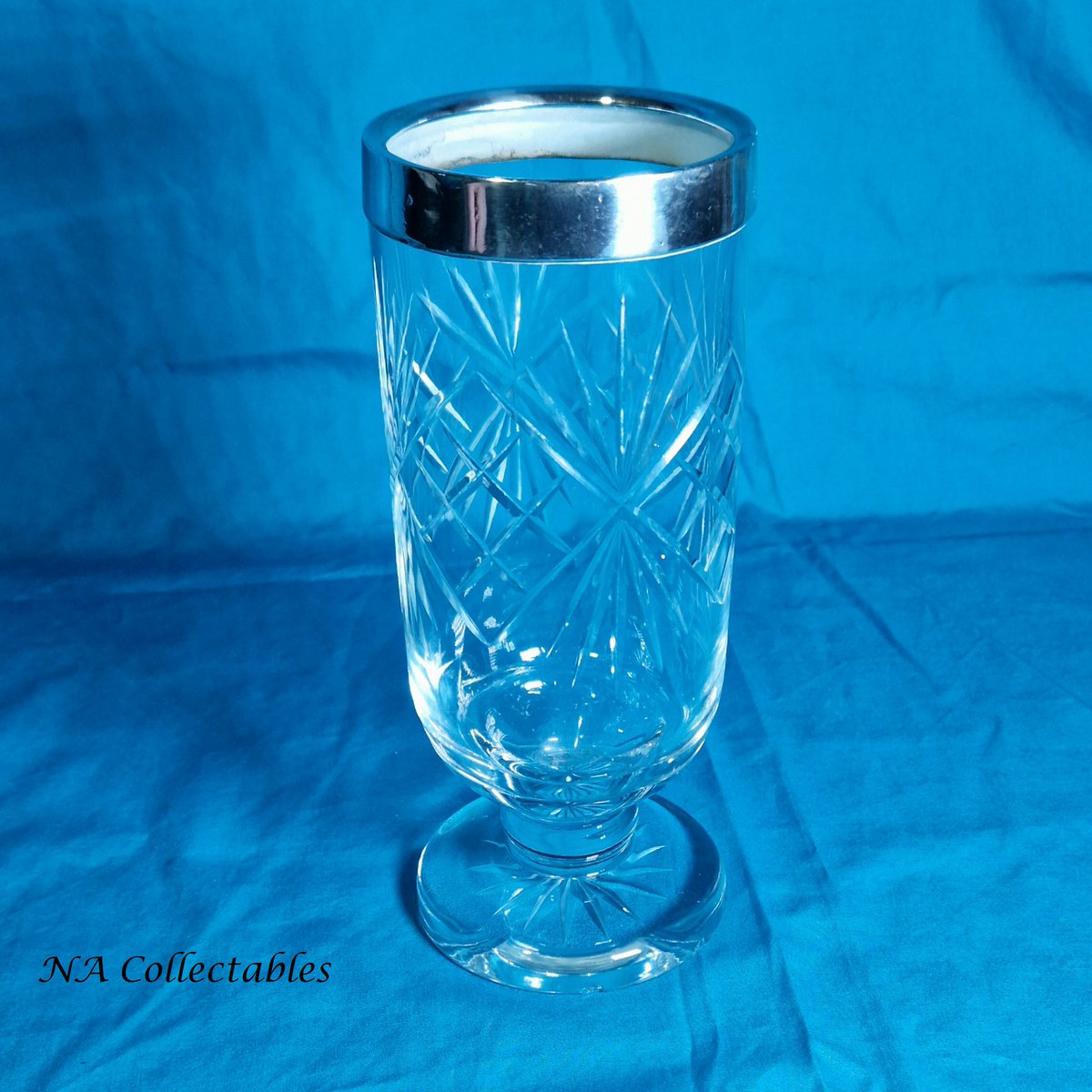Like the bowl this 1950's vase has a metal rim but with lead crystal glass. 
etsy.me/43m0LbL
@everrotating #vintageshowandsell #reusevintage #vintageglass #cutcrystal #vintagestyle #vintagehome #lovevintage #buyvintage #retro #retroglass #glassware