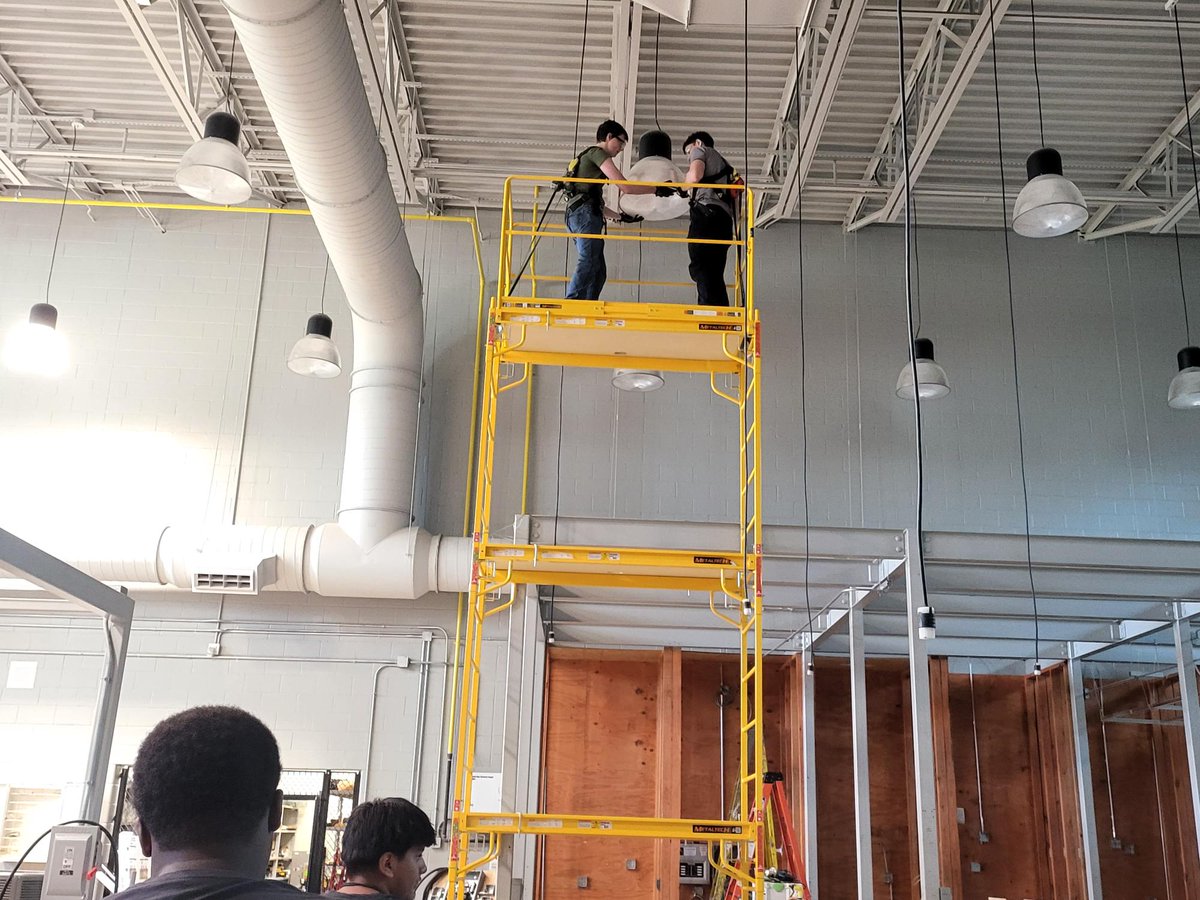 TECCWElectrical's tweet photo. Students learning what its like to do true electrical work 30 feet high. Harnesses on and working over head. They did a great job conquering their fear of heights and getting the work done. @HumphreyBrooks @lisdcte @LewisvilleISD @GilbreathJustin https://t.co/W4iY2nyxMi