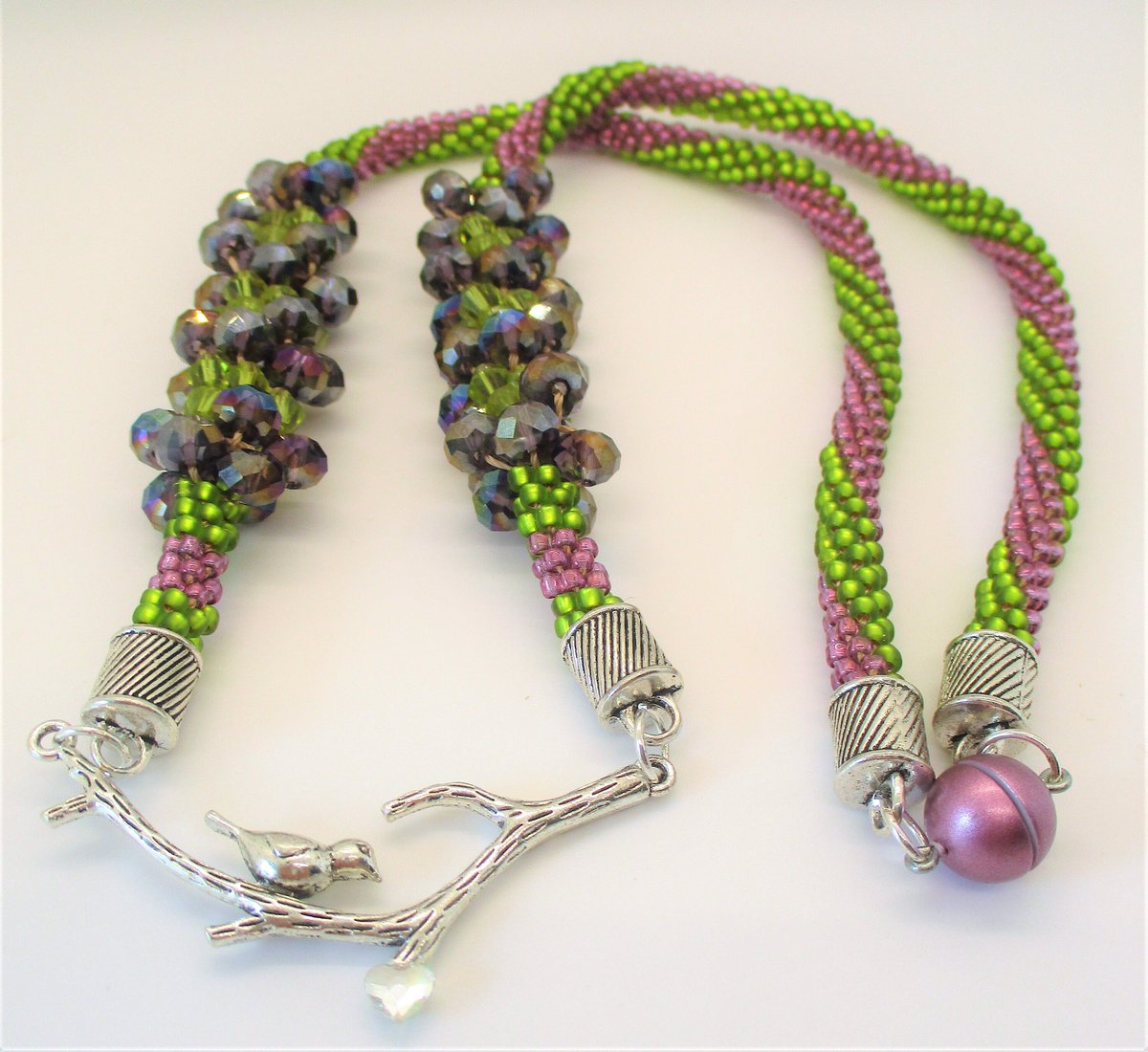 Excited to share the latest addition to my #etsy shop: sparkling green and purple braided necklace etsy.me/3UwLHE2 #green #plantstrees #purple #no #magnetic #swarovski #bird #magneticclosure #silver #etsy.com/shop/tartocstreasures