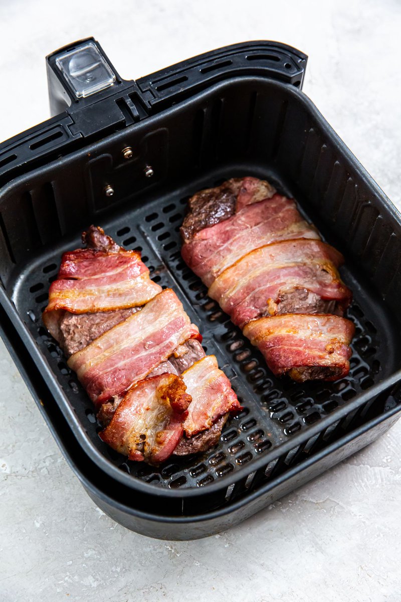 These #AirFryer Bacon Wrapped #Ribeye Steaks come out incredibly juicy! They cook in less than 15 minutes. Perfect for when you want a quick and easy #lowcarb dinner. laraclevenger.com/air-fryer-baco… via <a href="/LaraClevenger/">Lara Clevenger</a>