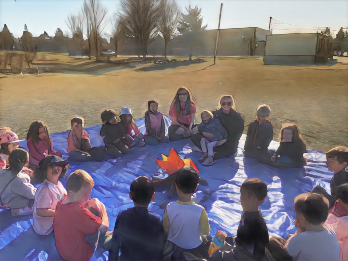 Kindergarten enjoying the great outdoors.....fake fire pit included.