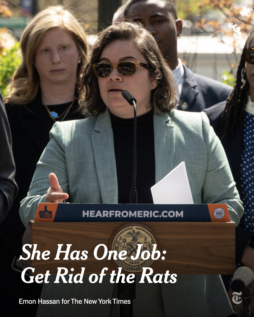 Kathleen Corradi, New York City's new director of rodent mitigation, speaks at a press conference. A headline reads: "She Has One Job: Get Rid of the Rats." Photo by Emon Hassan for The New York Times.