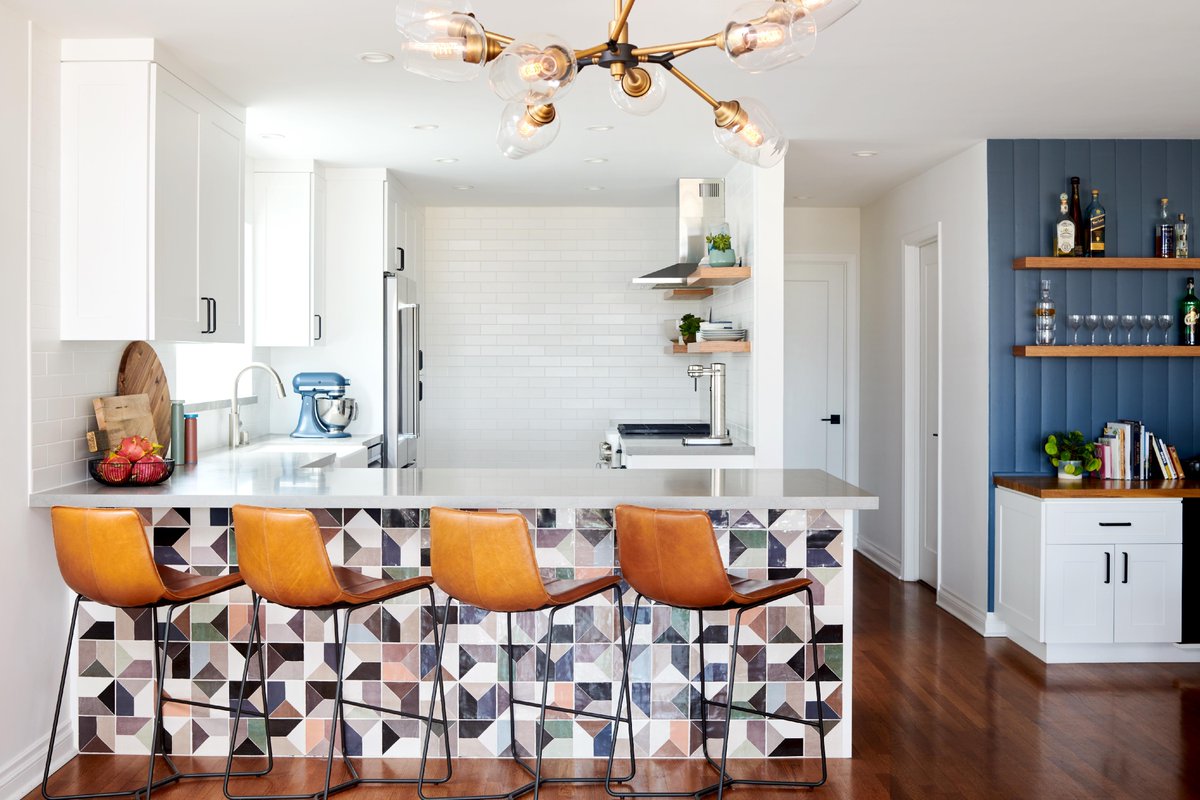 If only I could keep my kitchen this clean & pristine all week long...

#ImageDescription: Bright white backsplash tile and cabinetry is offset by a colorful mosaic tile on the peninsula in a kitchen.

#ShannaShryneDesign #KitchenUpgrade #HowYouHome #Renovate #Design #Interior...