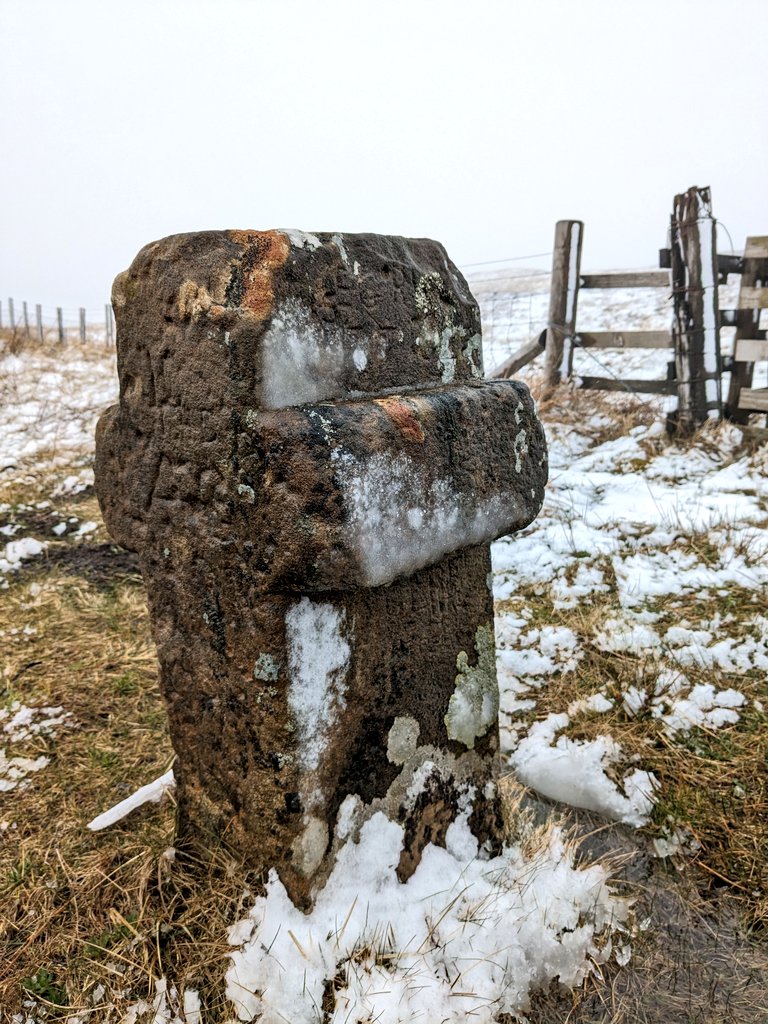 Helencello's tweet photo. Snow today at Killhope Cross. A small roadside cross, thought to be of medieval origins on the border between Cumbria &amp; County Durham .The carved stone cross is sited at the summit of the highest 'A' road in England, 627 metres above sea level.
@Englands_NE @ThisisDurham #snoe https://t.co/FfhsorGoUQ