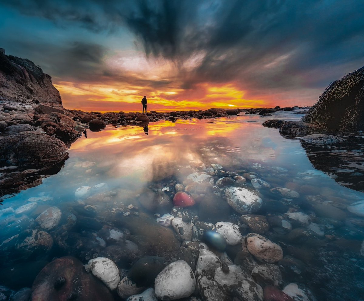 It was an explosion of color on this day. I actually had to desaturate the sky a bit. There were colorful rocks in the water and a nice reflection to top it off. #sunset #ocean #nature