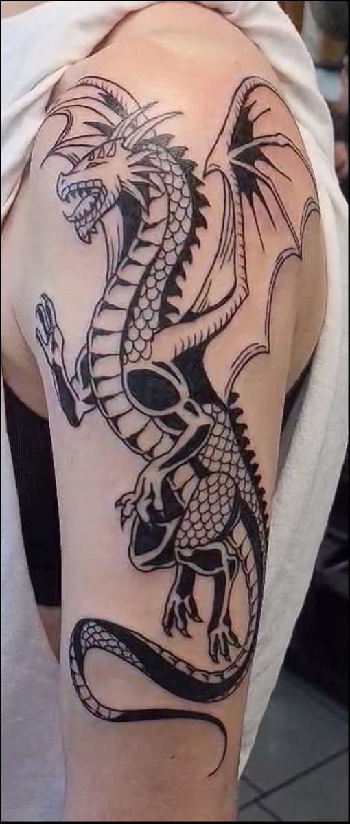 Kruzadar's tweet photo. Fred has been immortalized on my arm. The sleeve has officially started 🐉💕 

FAQs from stream: No, not coloring! I wanted high contrast x dark fantasy. Tattoo artist gave me exactly what I wanted and somehow did it in ~3hrs. I love it so much 🤩 https://t.co/Bd3w1cZGdq