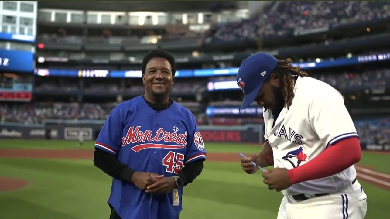 BaseballHistoryNut on X: This is all kinds of awesome. Pedro Martinez  threw out the first pitch tonight in an Expos jersey to Vlad Jr, who's his  Godson  / X
