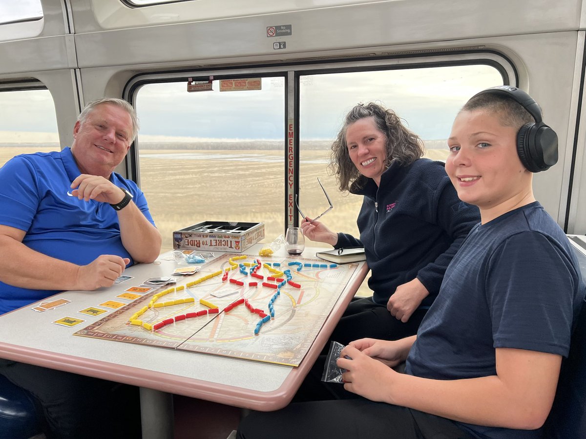 suzannemurtha's tweet photo. Alan came up from the kitchen!!  Zack and Noelani and Alan made us an amazing @Amtrak dinner on the #empirebuilder.  We so love our #traincations.  I think @keenezyk can actually beat me at #tickettoride …but maybe not ❤️ https://t.co/btrb9c5zsK