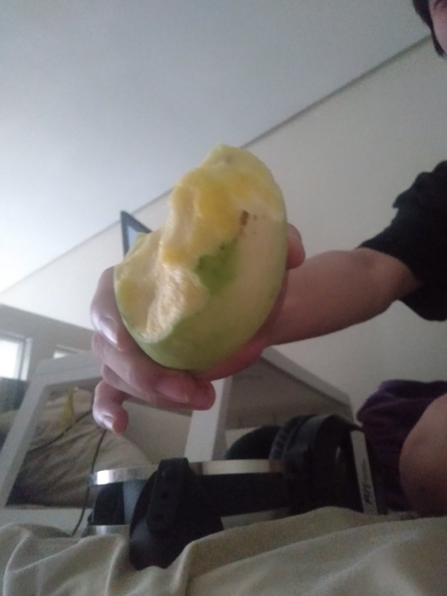 This mf eating a mango with the skin on like a goddamn apple.