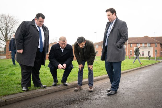 PolitlcsUK's tweet photo. 🚨 | NEW: Rishi Sunak's stare at a pothole two weeks ago still hasn't been fixed... and has actually got a lot deeper 

[@JackElsom] https://t.co/oIlrPZZQeN